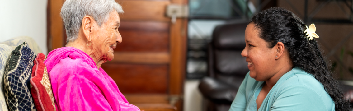 elderly woman with a caretaker