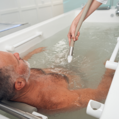 person bathing an elderly